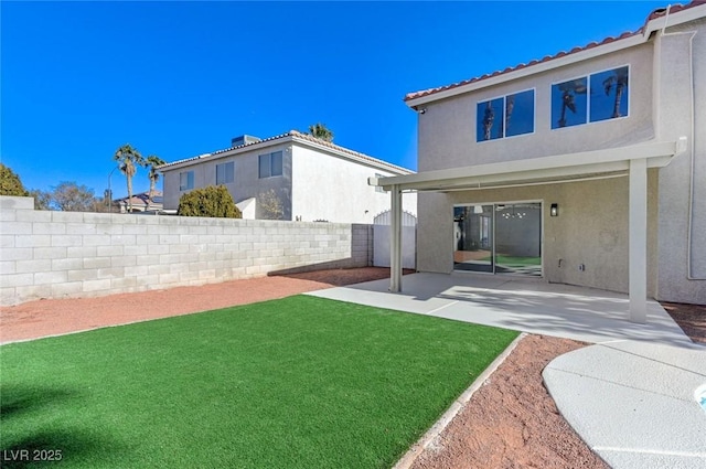 view of yard featuring a fenced backyard and a patio