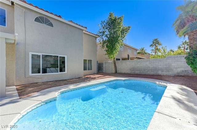 view of swimming pool featuring a fenced in pool and fence