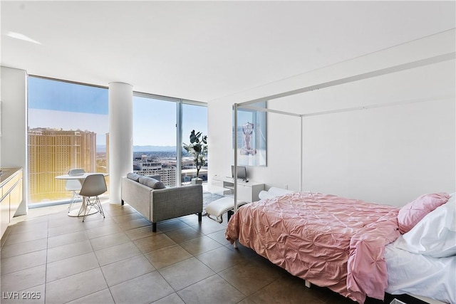 tiled bedroom featuring floor to ceiling windows