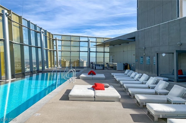 community pool with a patio area