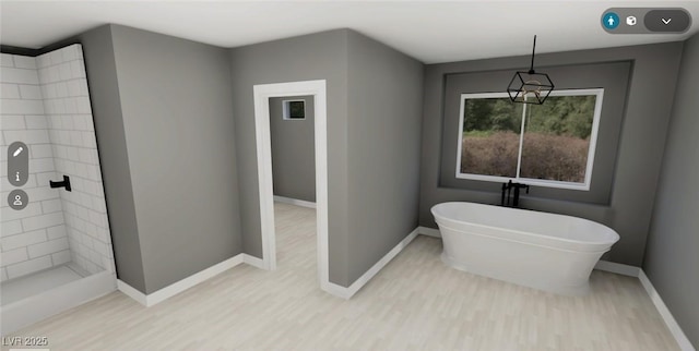 full bath featuring a soaking tub, a tile shower, baseboards, and wood finished floors