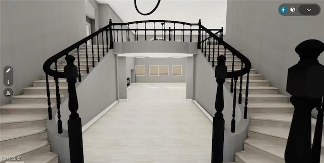 stairway featuring baseboards