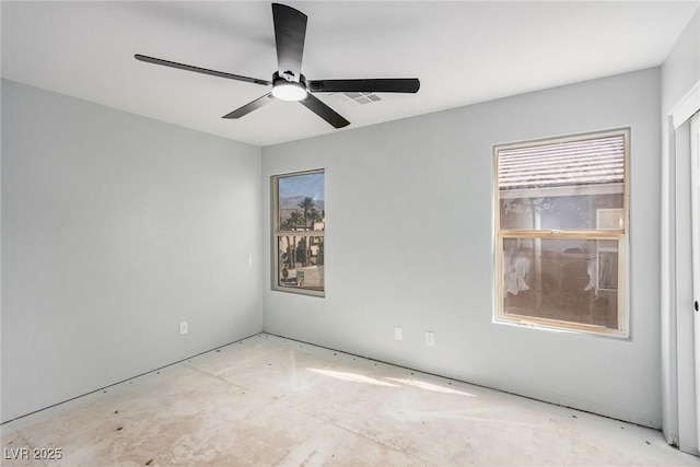 spare room with ceiling fan