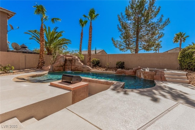 view of swimming pool featuring a patio area, a fenced backyard, and a fenced in pool