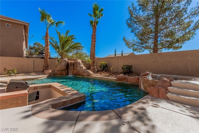 view of pool featuring exterior kitchen, a fenced backyard, and a fenced in pool