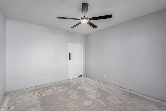 spare room featuring ceiling fan and unfinished concrete flooring