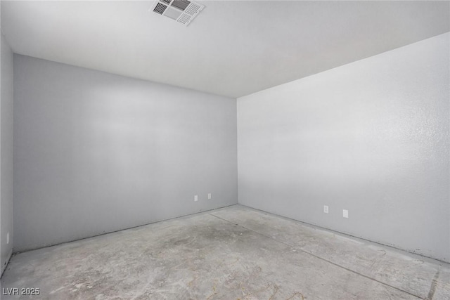 spare room with visible vents and unfinished concrete floors