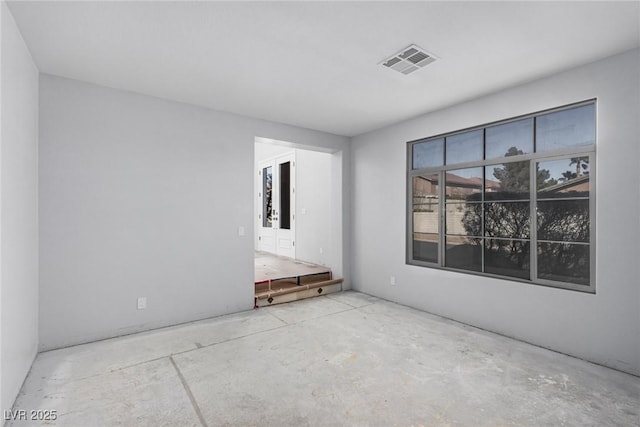 unfurnished room featuring visible vents and unfinished concrete flooring