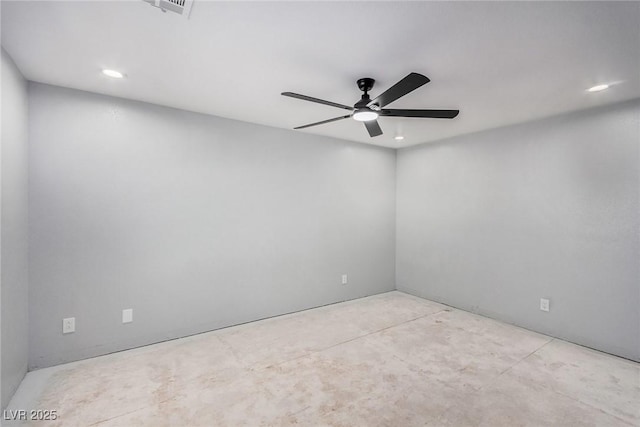 spare room with ceiling fan, concrete flooring, and recessed lighting