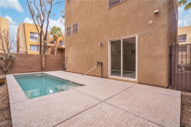 view of swimming pool with a patio area and a fenced backyard