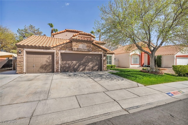 mediterranean / spanish-style house featuring concrete driveway, stone siding, a tiled roof, an attached garage, and stucco siding