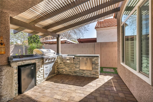 view of patio featuring a pergola, area for grilling, a fenced backyard, and a grill