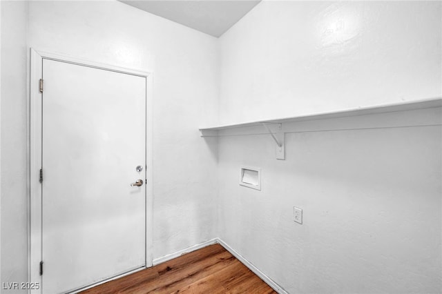 laundry area featuring washer hookup, wood finished floors, and laundry area