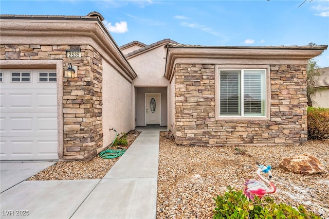 property entrance with stone siding, stucco siding, and an attached garage