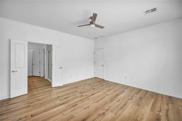 unfurnished bedroom with light wood-style floors, visible vents, and ceiling fan