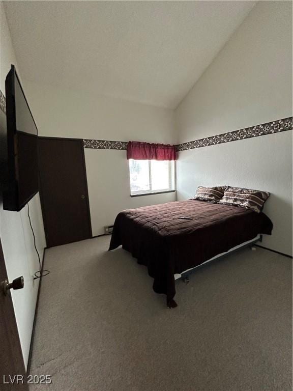 bedroom with light carpet and vaulted ceiling