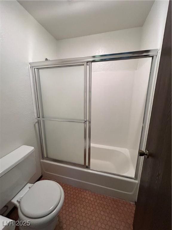 full bath featuring shower / bath combination with glass door and toilet