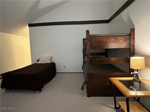 carpeted bedroom featuring lofted ceiling