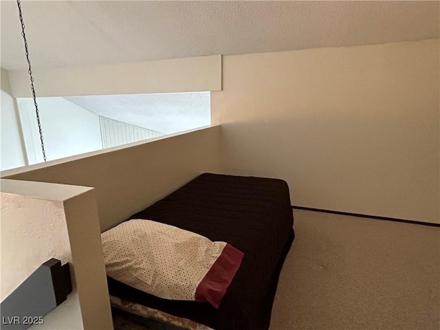 bedroom featuring carpet and vaulted ceiling