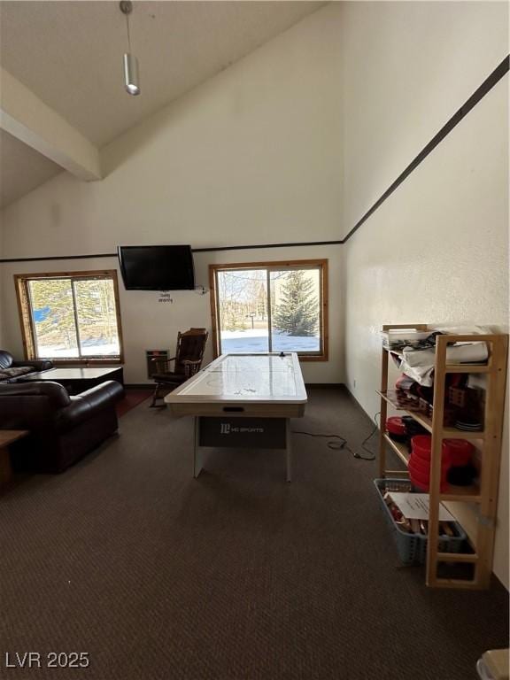 playroom with high vaulted ceiling, dark carpet, and beam ceiling