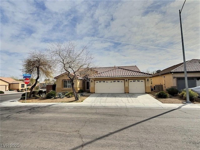 view of front facade featuring a garage, driveway, cooling unit, and stucco siding