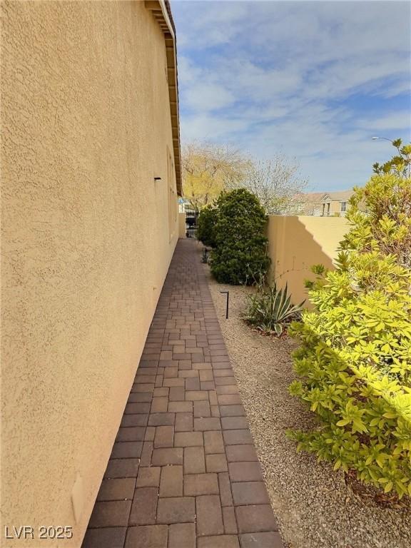 view of side of home with stucco siding