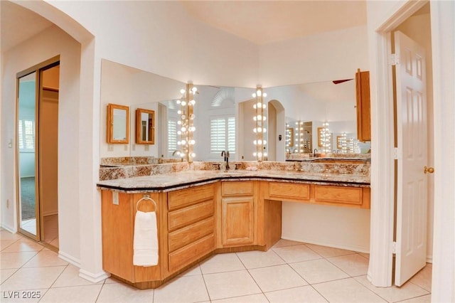 bathroom featuring tile patterned flooring and vanity