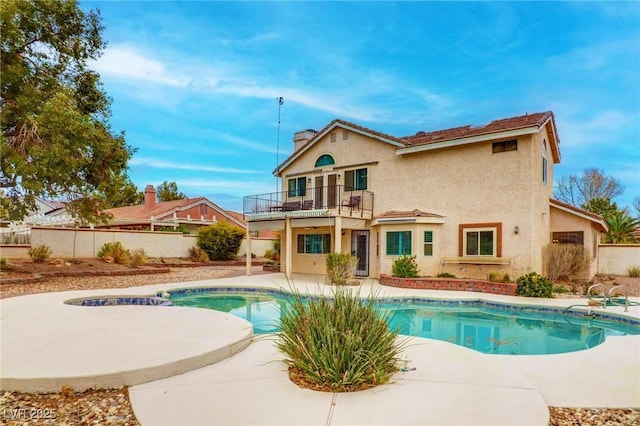 view of swimming pool with a patio area, fence, and a fenced in pool