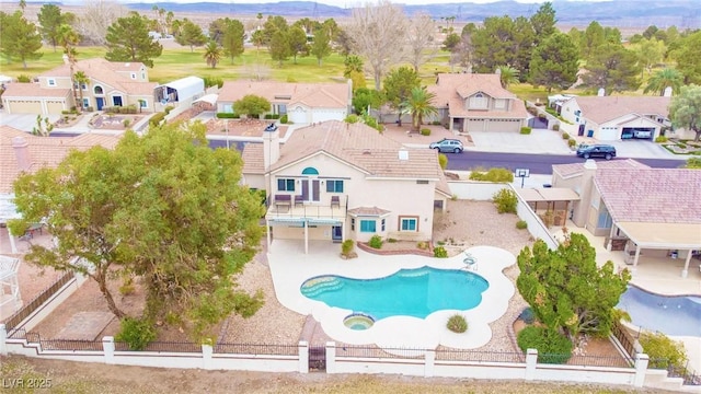 view of pool featuring a residential view, a patio area, and a fenced backyard