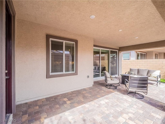 view of patio / terrace featuring fence and an outdoor living space