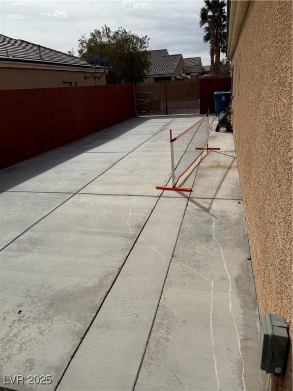 view of patio / terrace featuring fence