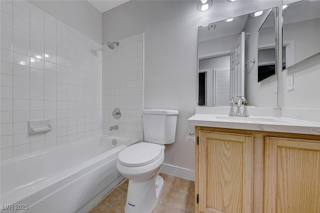 full bathroom with bathtub / shower combination, toilet, vanity, baseboards, and tile patterned floors