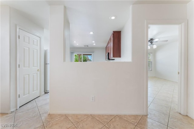 empty room with recessed lighting, ceiling fan, and light tile patterned floors