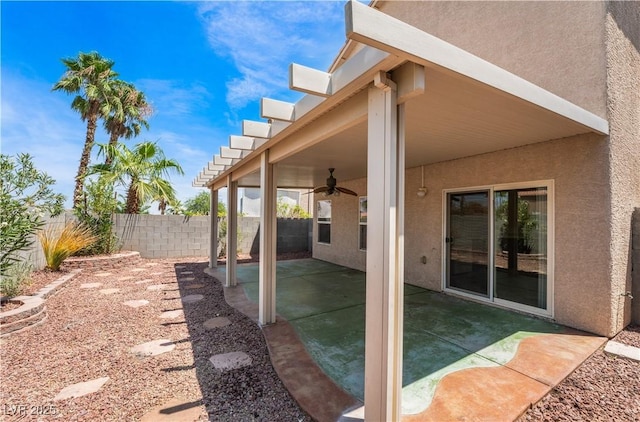 view of patio / terrace with a fenced backyard and ceiling fan