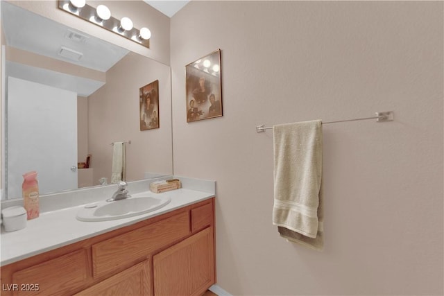 bathroom featuring visible vents and vanity