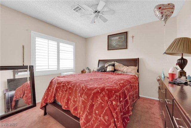 bedroom featuring baseboards, visible vents, a ceiling fan, a textured ceiling, and carpet flooring