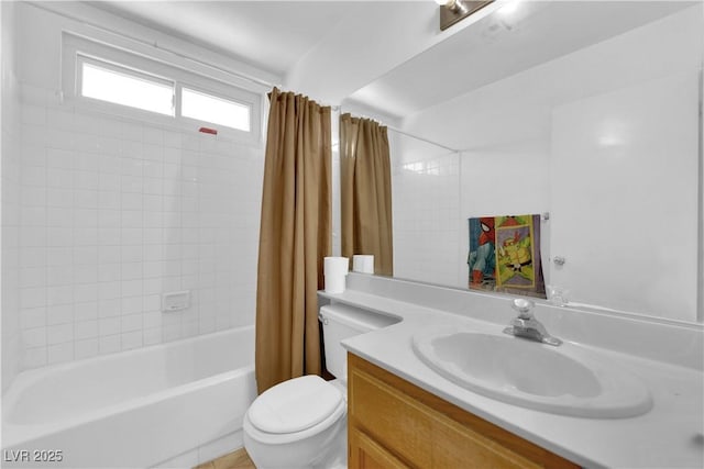 bathroom featuring shower / bath combo, vanity, and toilet