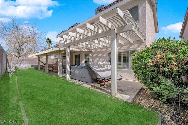 rear view of property with a yard, a hot tub, a patio area, a pergola, and a fenced backyard