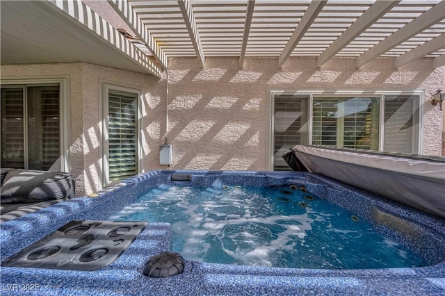 view of pool featuring a hot tub