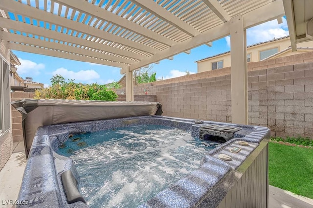 exterior space with fence and a hot tub