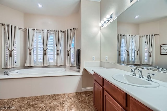 bathroom featuring a bath and vanity