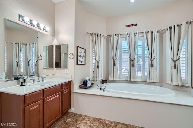 full bath with a garden tub and vanity