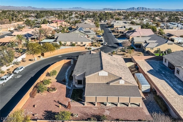 drone / aerial view with a residential view and a mountain view