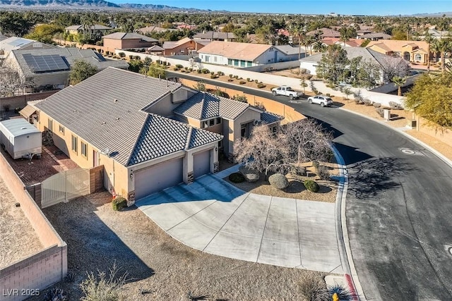 birds eye view of property with a residential view