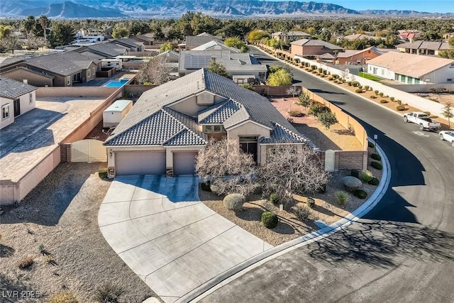 bird's eye view featuring a residential view and a mountain view