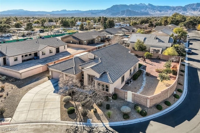 bird's eye view with a residential view and a mountain view