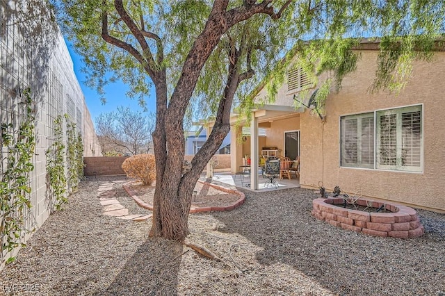 view of yard with a fenced backyard and a patio