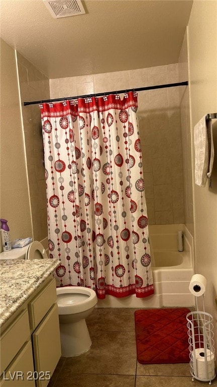 bathroom featuring visible vents, toilet, shower / tub combo, vanity, and tile patterned flooring