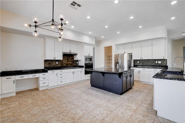 kitchen with visible vents, a sink, dark stone counters, under cabinet range hood, and black appliances