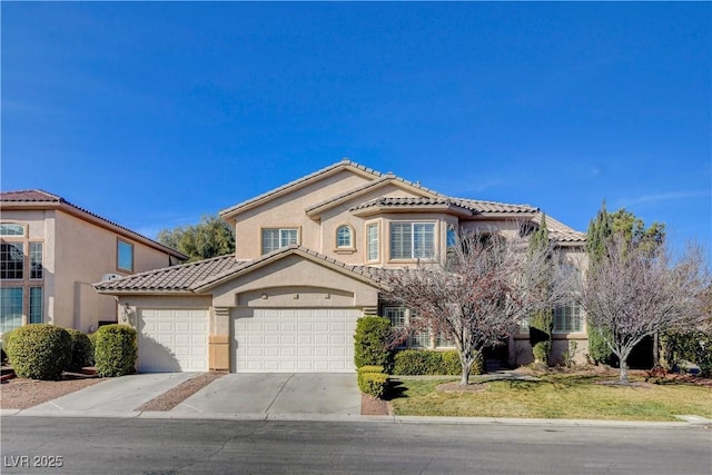 mediterranean / spanish-style home featuring a garage, a tile roof, concrete driveway, stucco siding, and a front yard